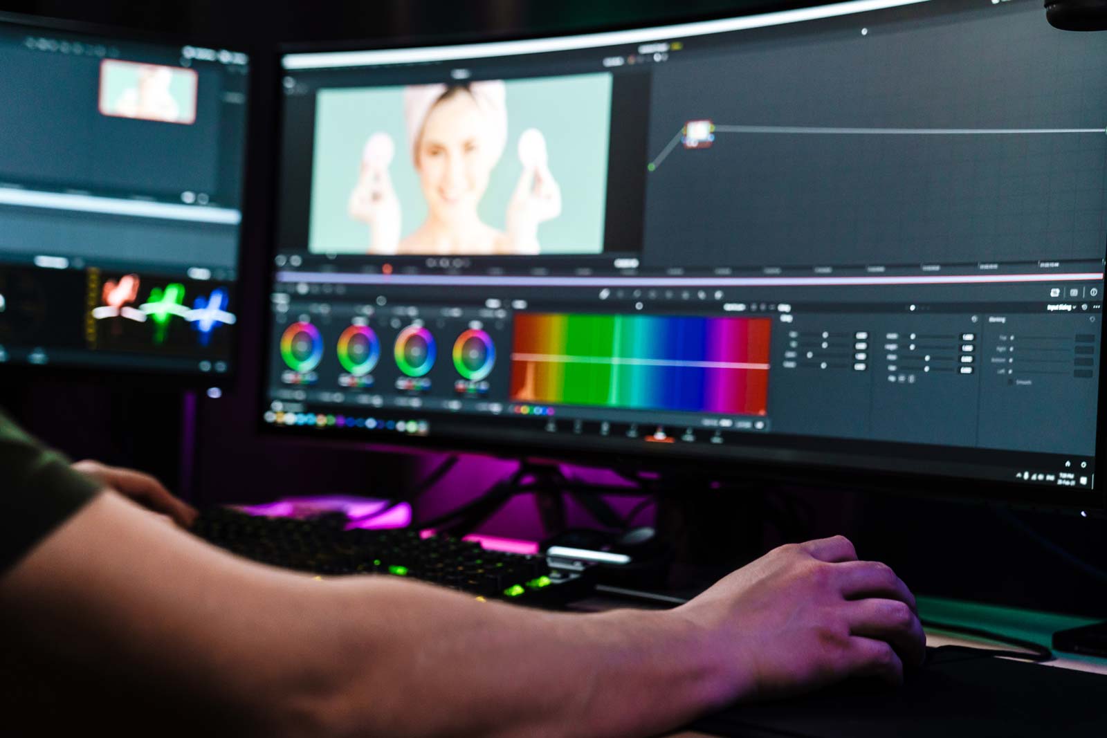 back view of a young man video editor creating video advertisement