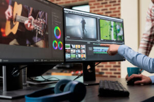 professional digital movie editor sitting at desk